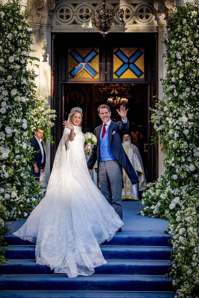 Princess Theodora waving to onlookers with Crown Prince Pavlos