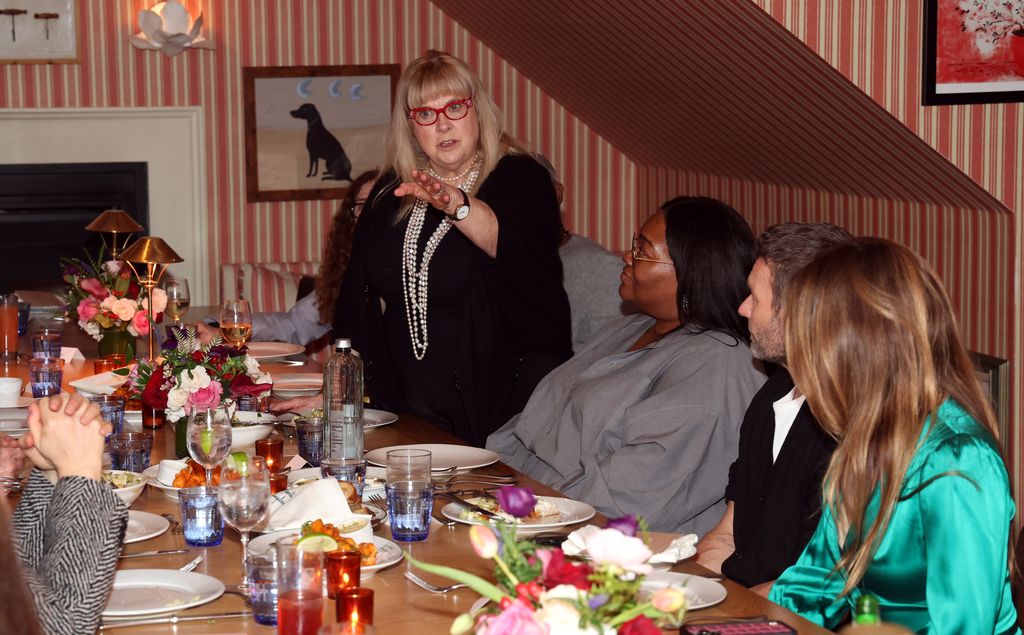 colleen camp talking at dinner table