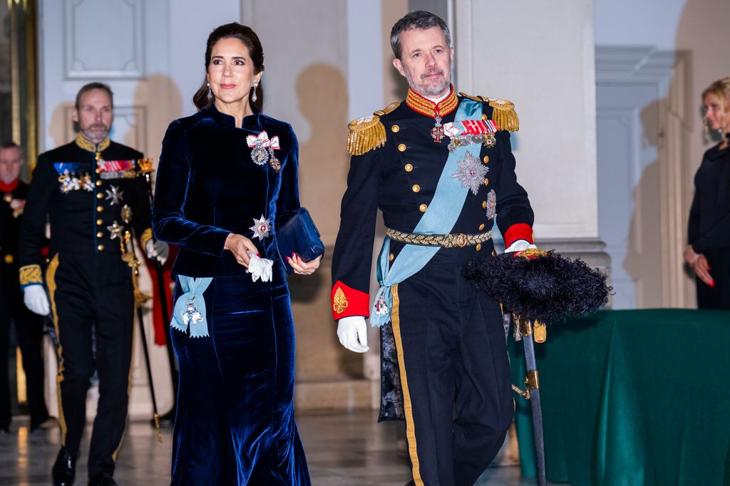 Queen Mary in navy velvet beside frederik in uniform