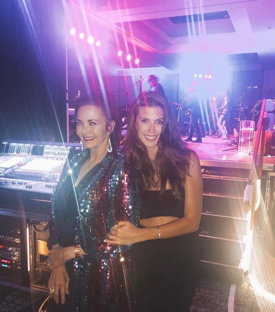 Lynda Carter and daughter Jessica pose side of stage 