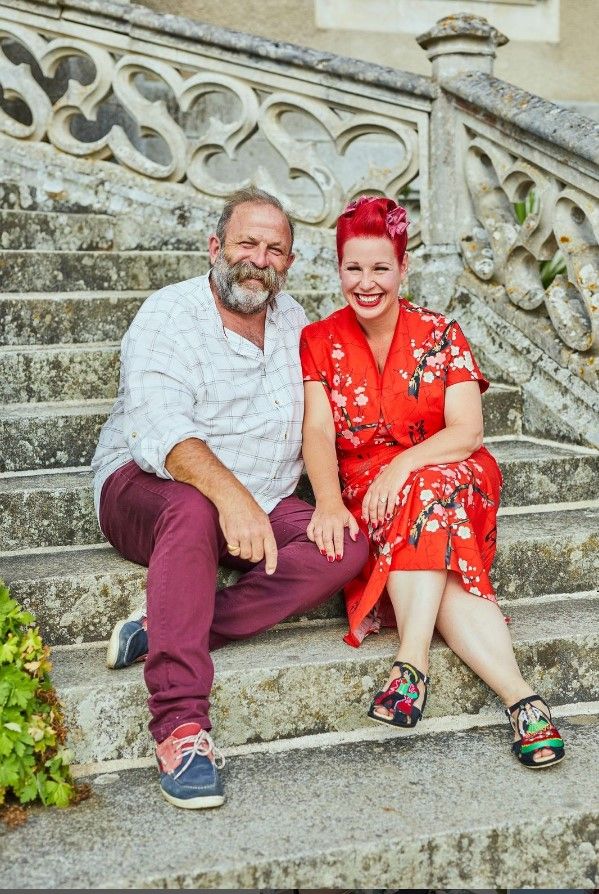 Dick and Angel Strawbridge are sitting on the steps