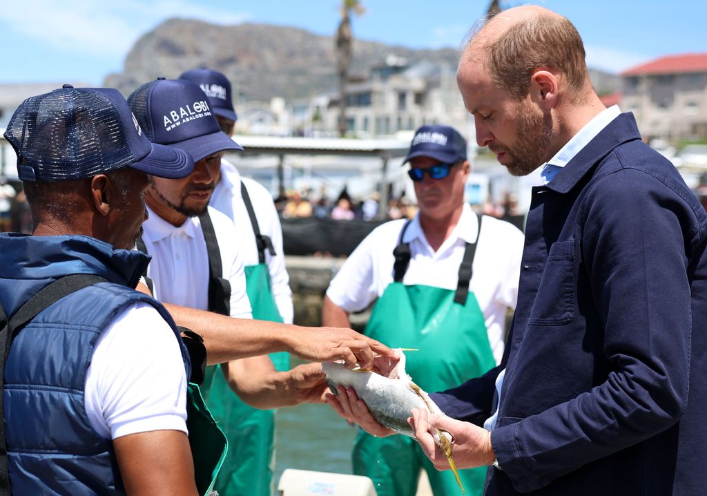 Prince William holding a fish