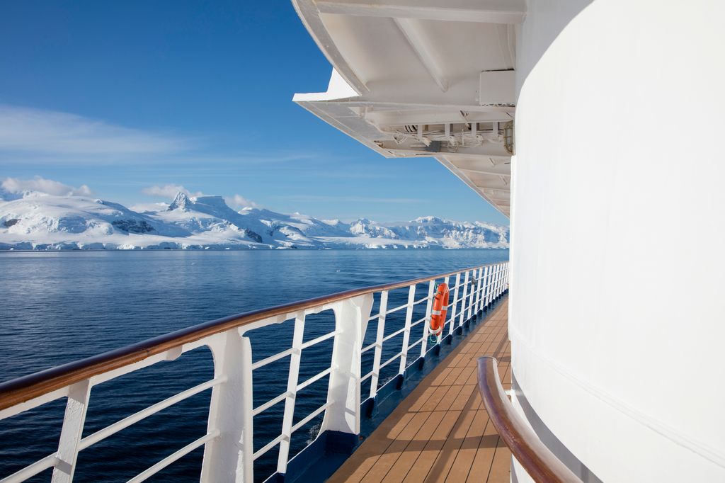 Cruise ship deck with snowy mountains in the distance