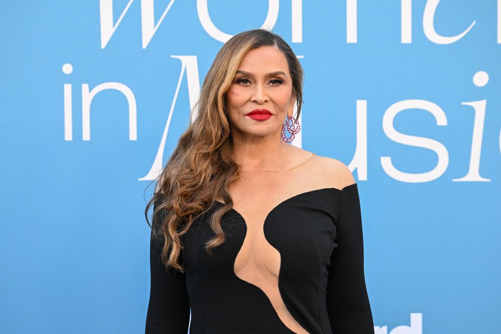Tina Knowles on the red carpet in black dress