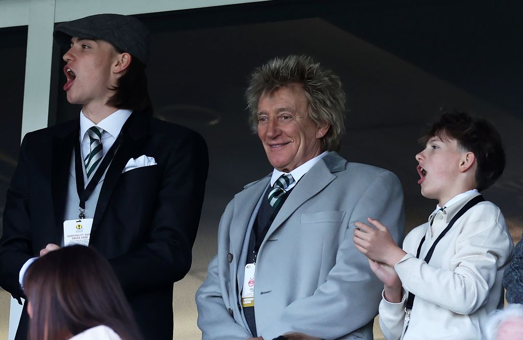 Alastair Stewart, Rod Stewart and Aiden Stewart at a football match, with Alastair and Aiden cheering