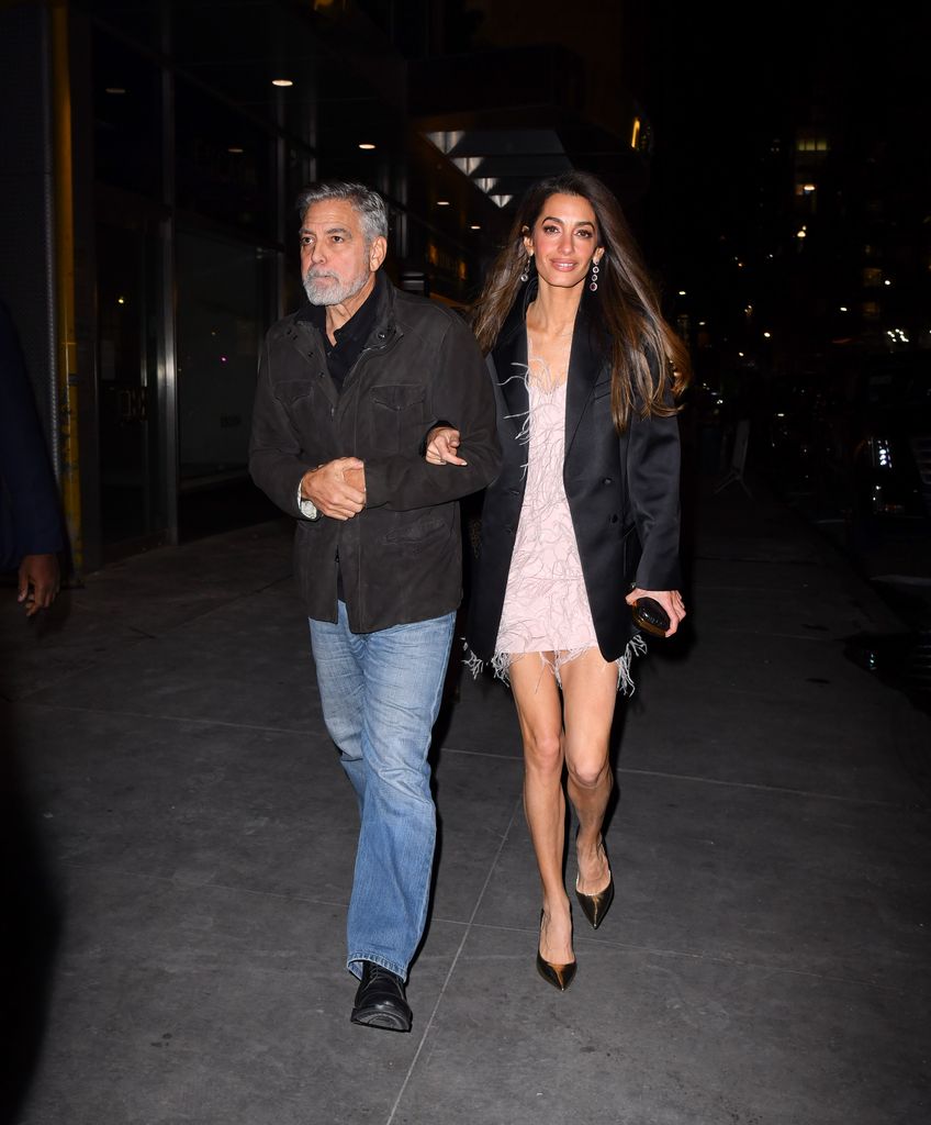 NEW YORK, NEW YORK - DECEMBER 13: George Clooney and Amal Clooney arrive to the Polo Bar on December 13, 2023 in New York City. (Photo by James Devaney/GC Images)