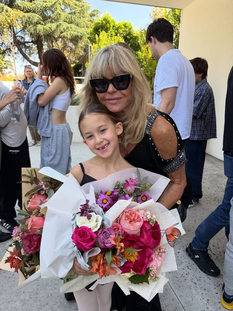 Goldie posing with Rani after her ballet perfomrance