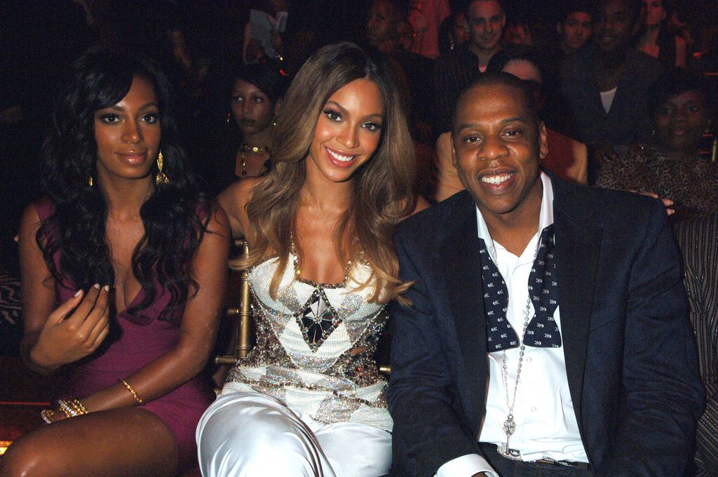 Solange Knowles sitting with Beyonce and Jay-Z