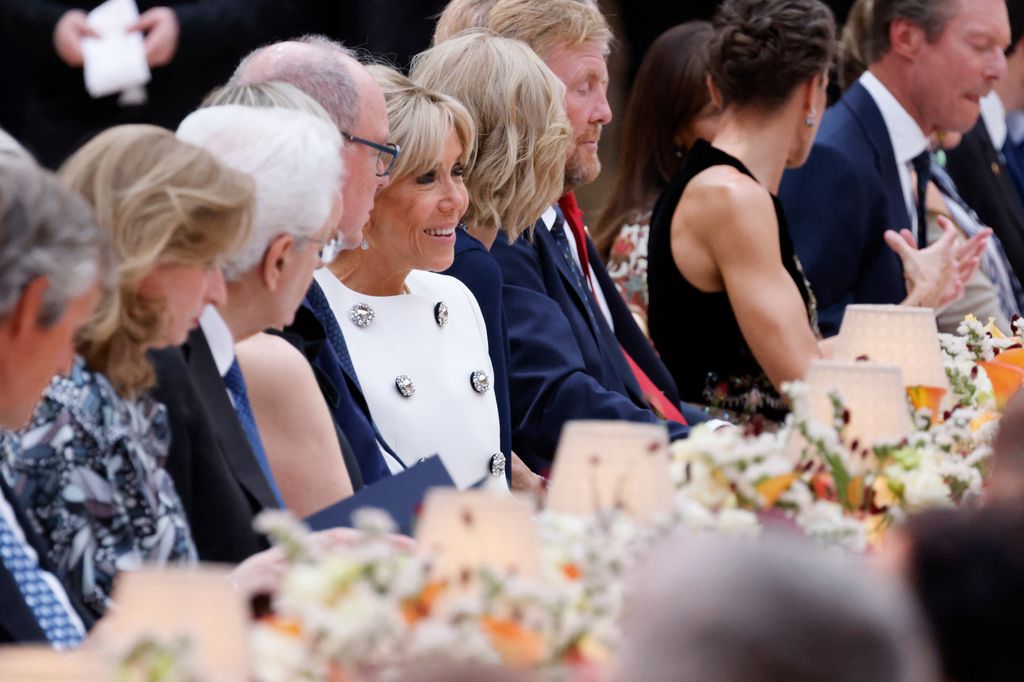 French President's wife Brigitte Macron (5thL) is seated near King Willem-Alexander and Queen Letizia (second right)