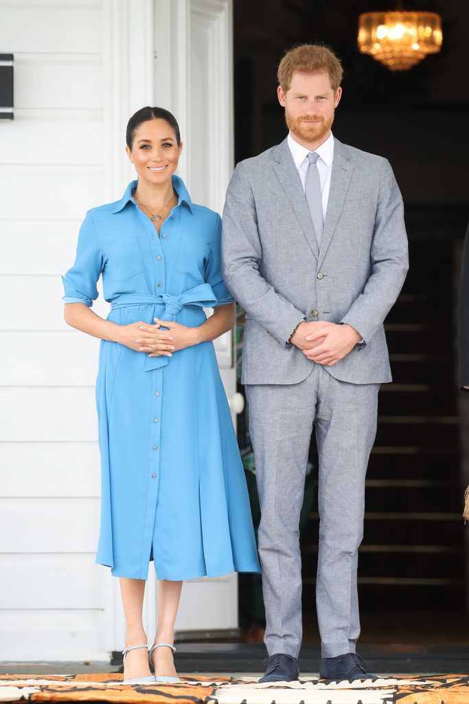 prince Harry, Duke of Sussex and Meghan in blue shirt dress