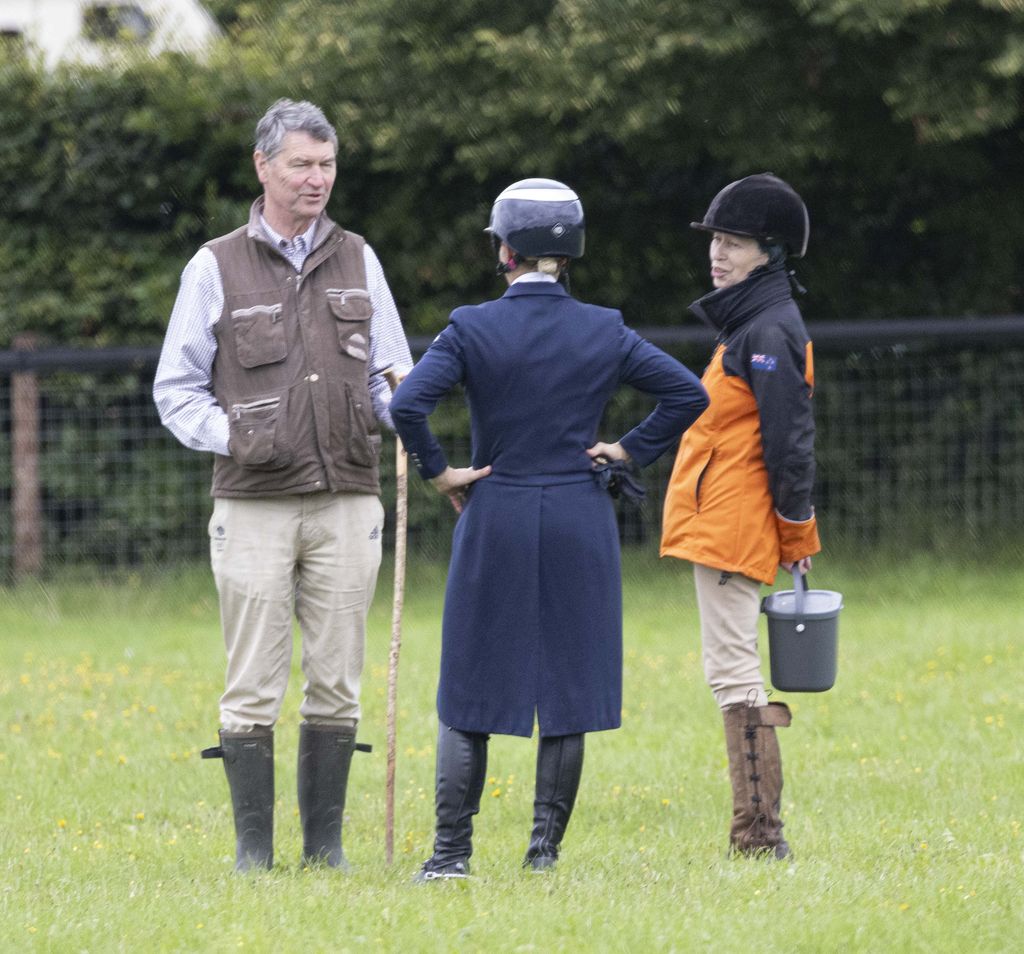 Princess Anne and Sir Timothy Laurence speaking to Zara Tindall