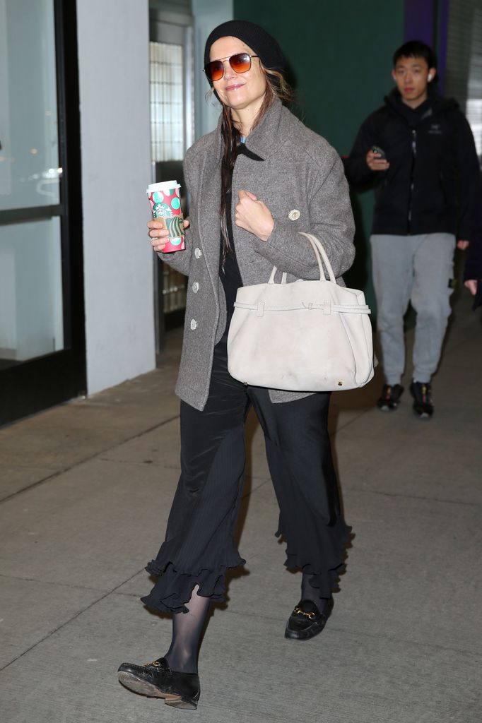 Katie Holmes made a stylish appearance ahead of her birthday carrying coffee smiling NY