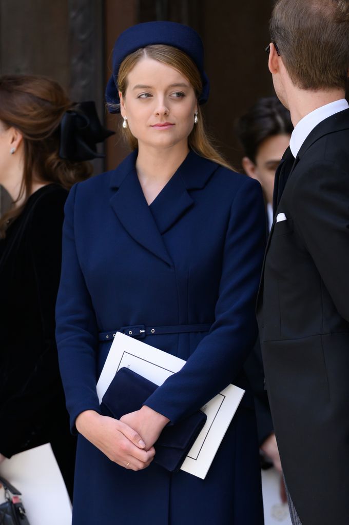 Flora Vesterberg in a blue dress and pearl earrings