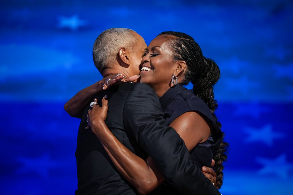 Michelle Obama hugging Barack Obama 