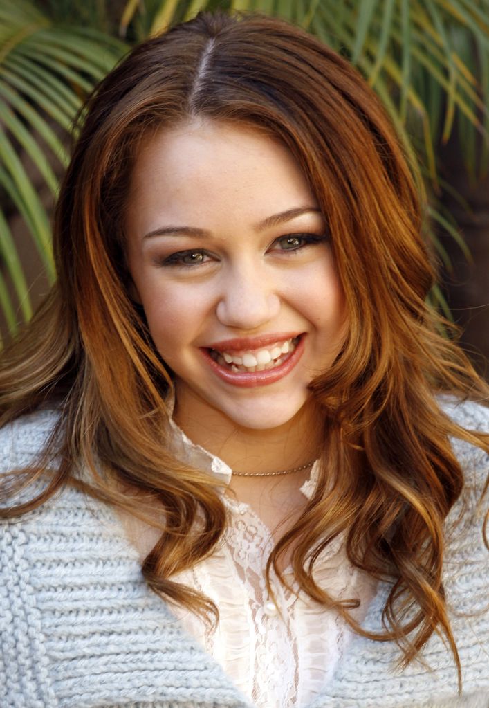 Miley Cyrus smiling when she was very young