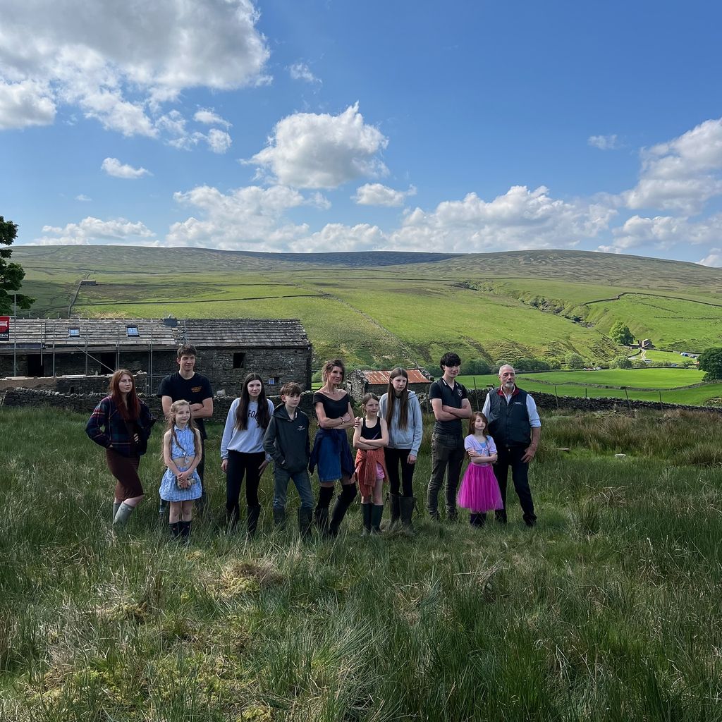 Our Yorkshire Farm stars Amanda and Clive Owen pose on the farm with their nine children
