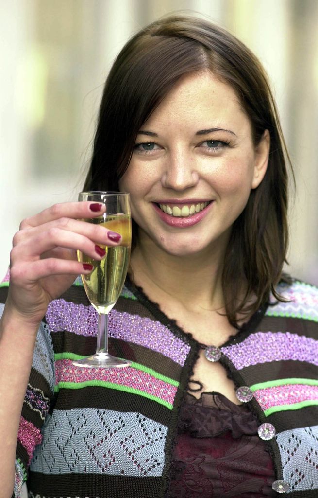 Sara Cox celebrates with a glass of champagne, in London, after she was named as the replacement for best pal Zoe Ball as host of the BBC Radio 1 breakfast show