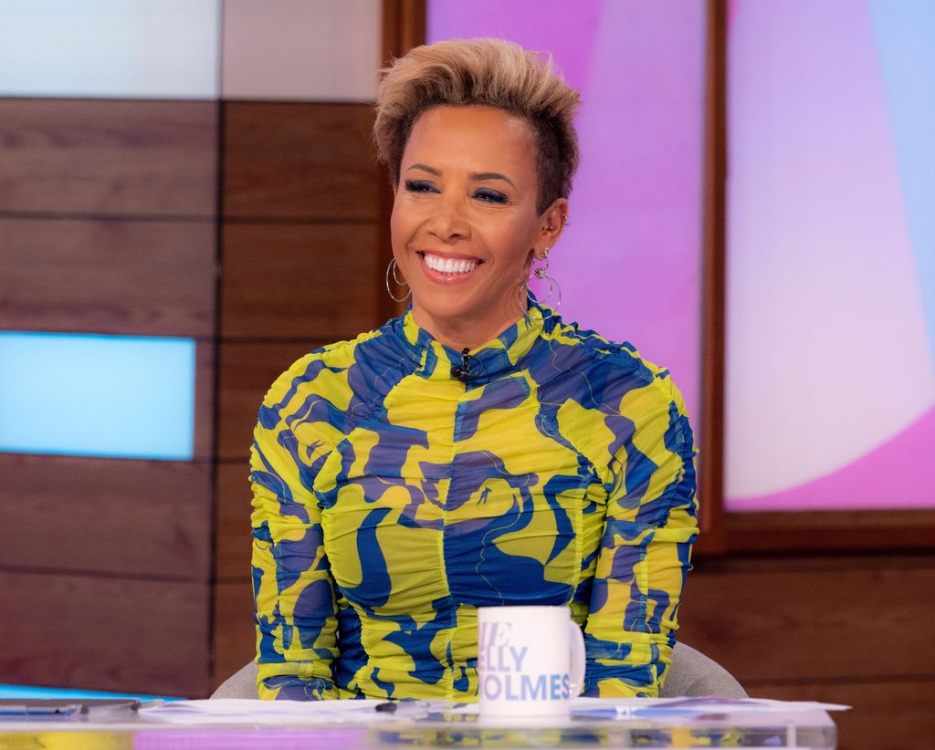 Kelly Holmes on Loose Women in a blue and yellow top