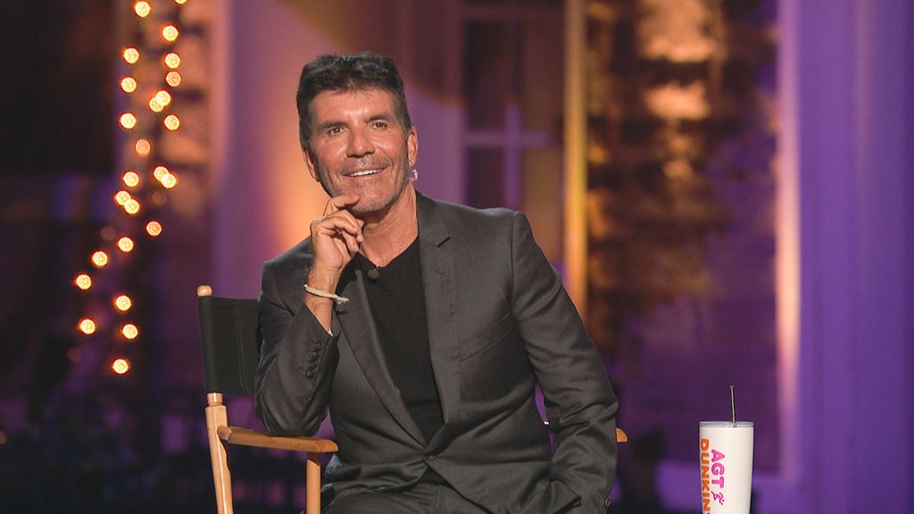 Simon Cowell in gray suit on set for America's Got Talent