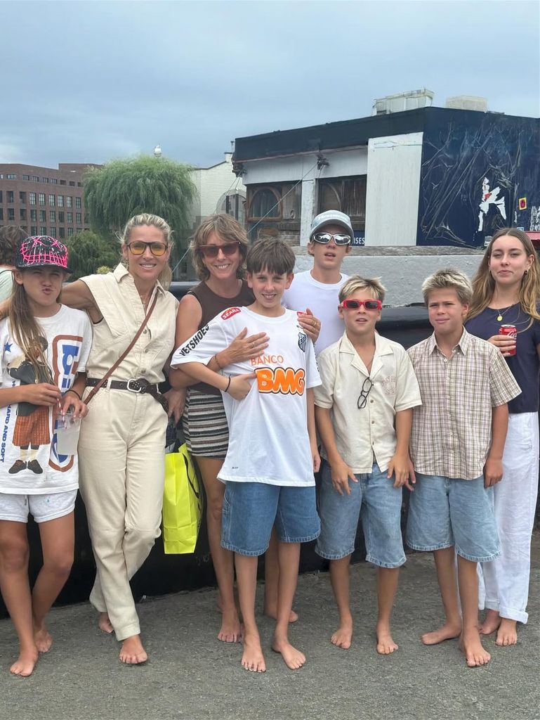 Elsa Pataky and her three kids with Chris Hemsworth pose with friends barefoot in a photo shared from Madrid on Instagram