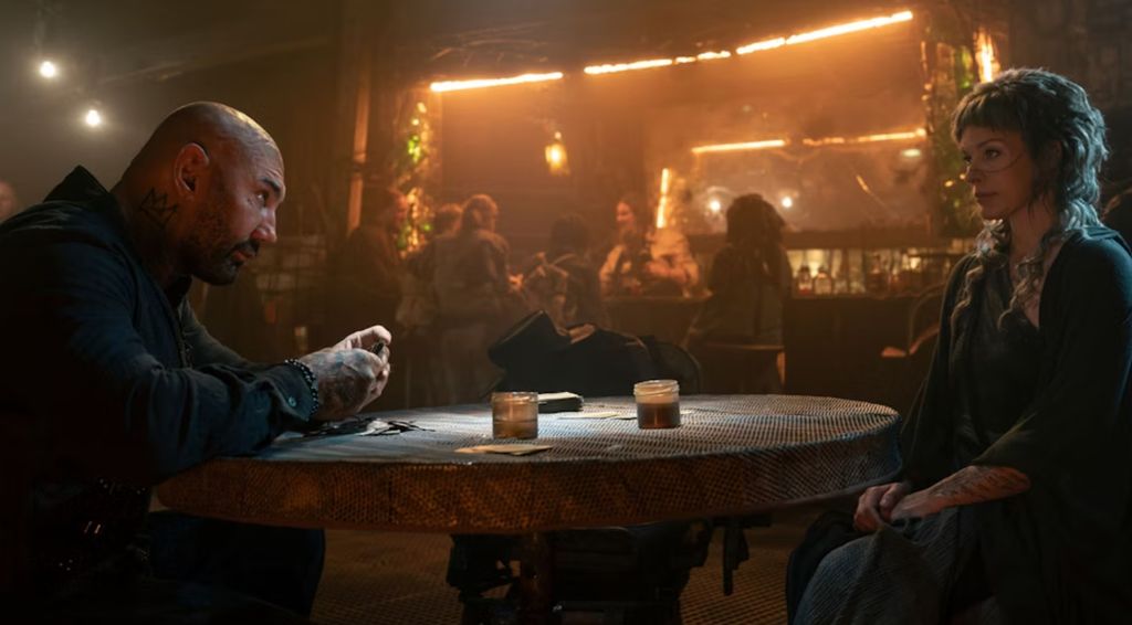 Dave Bautista and Milla Jovovich in a scene from In The Lost Lands