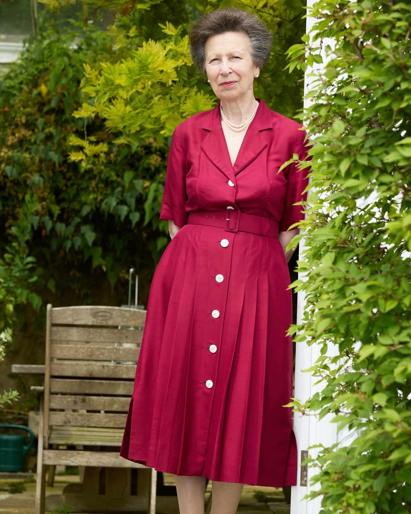 Princess Anne in red dress and pearls