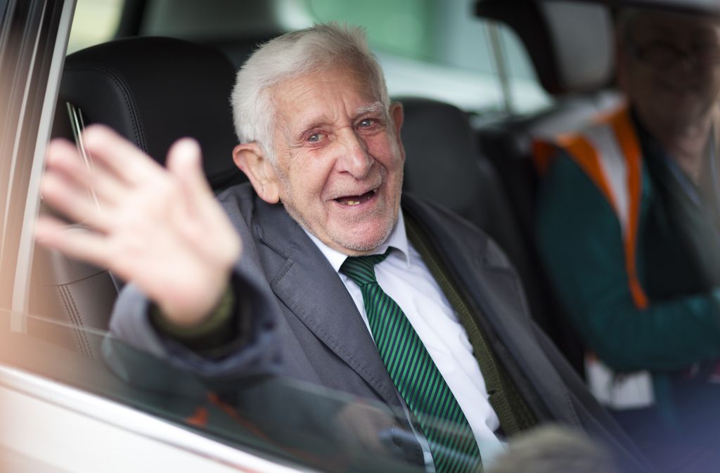 Bernard Jordan, the 90-year-old war veteran found in Normandy after being reported missing from his care home in Hove, Sussex, waves as he returns to Portsmouth on a Brittany Ferry.