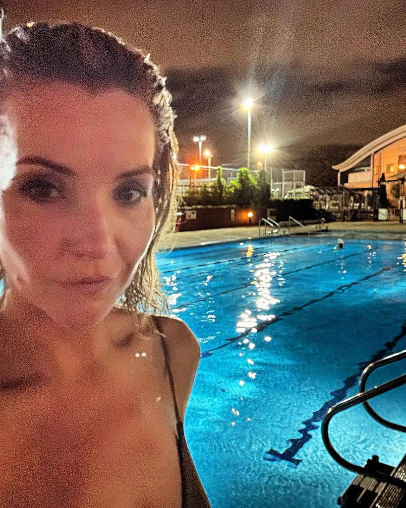 Helen Skelton posing beside a swimming pool