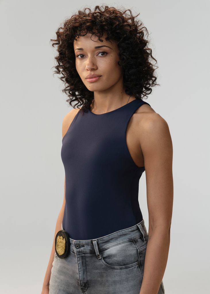 Olivia Swann as NCIS Special Agent Captain Michelle Mackey in NCIS: Sydney 
