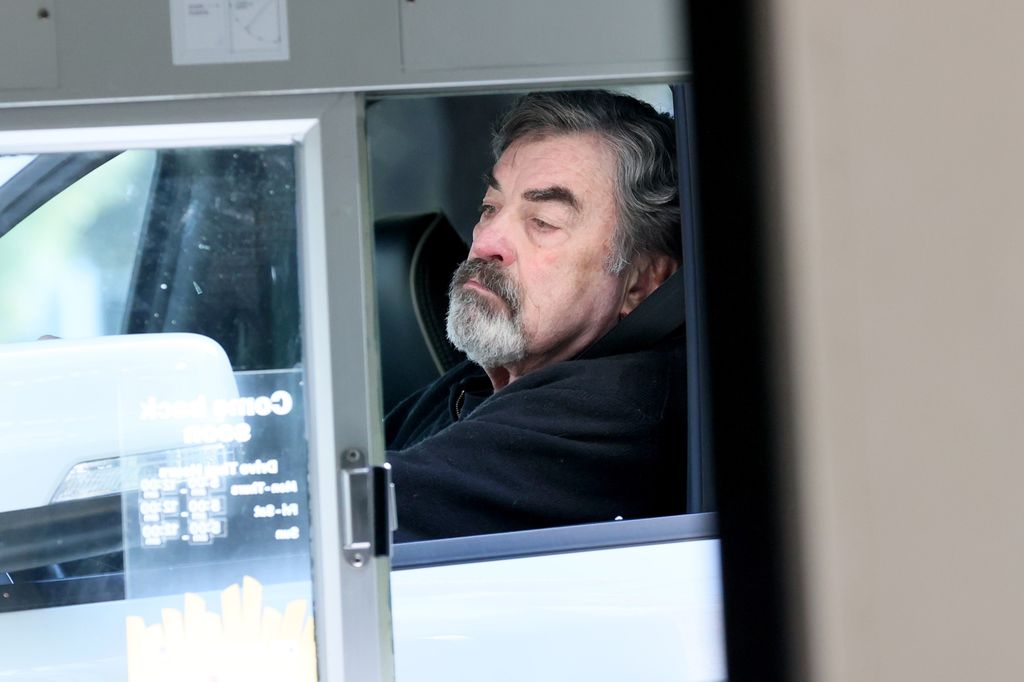 tom selleck in his car at mcdonalds drive thru