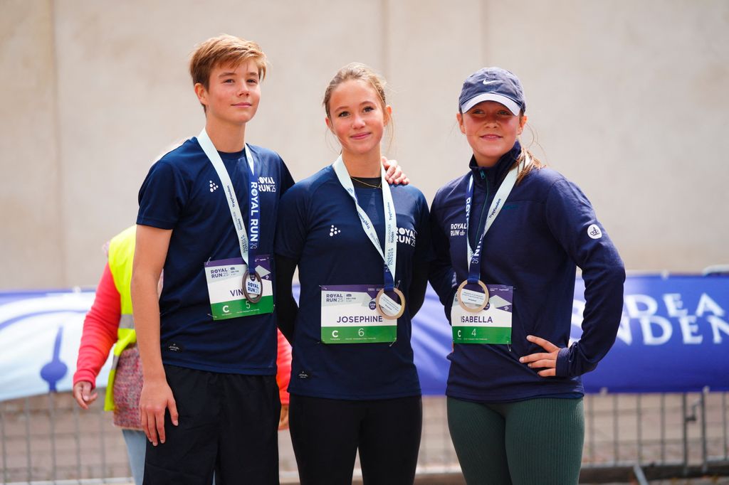 Princess Isabella (R), Princess Josephine (C) and Prince Vincent with medals