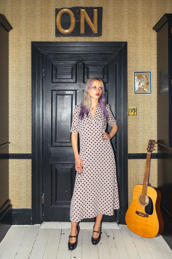 Pearl's daughter Betty models her new clothing line