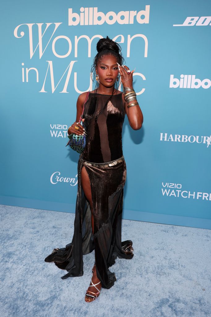 Doechii at the Billboard Women in Music 2025 in sheer vintage dress