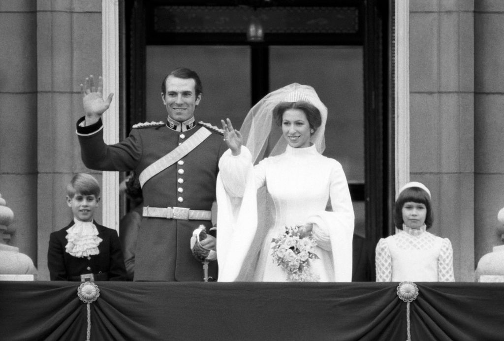 Princess Anne and Mark Phillips waving from the Buckingham Palace balcony on their wedding day 