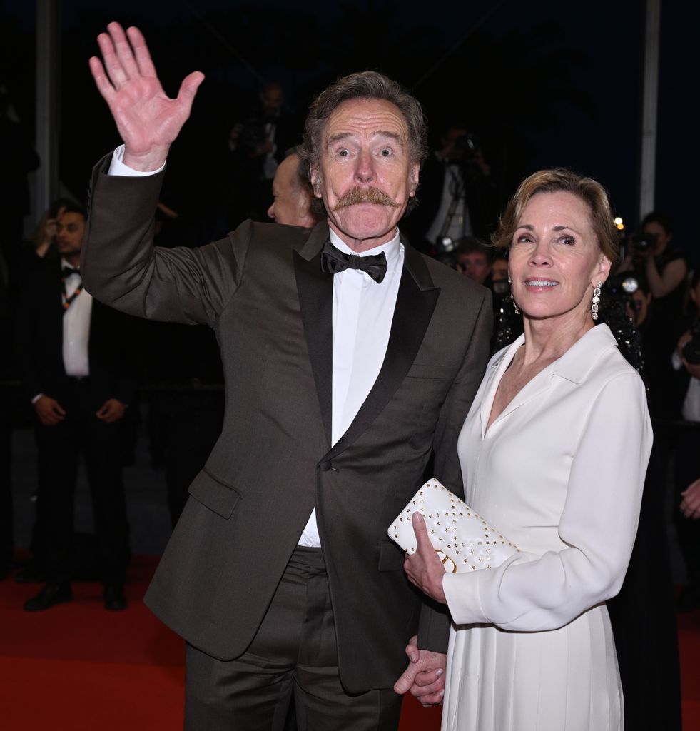 Bryan Cranston (L) and his wife actress Robin Dearden (R) leave after the premiere of the film Asteroid City 