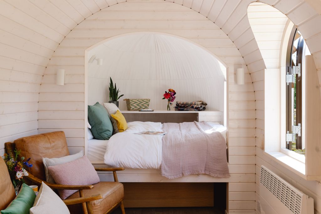 small bedroom nook in outdoor lodge