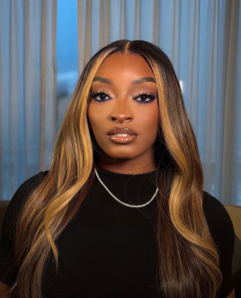 Simone Biles poses for a photo with her glam and new honey blonde highlights, shared on Instagram