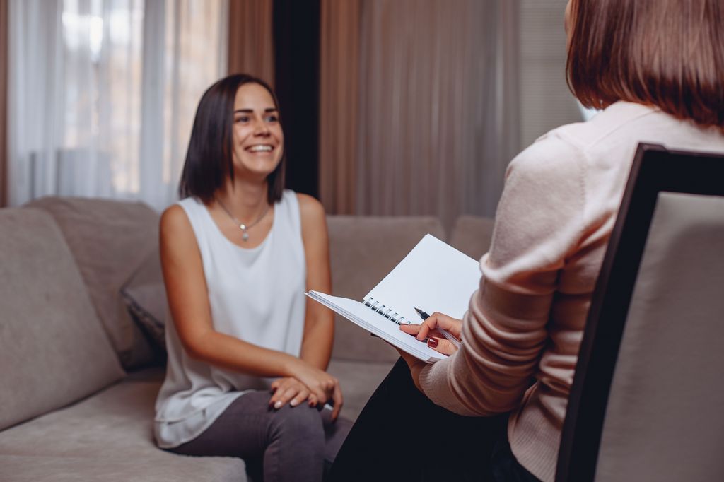 Woman smiling having therapy