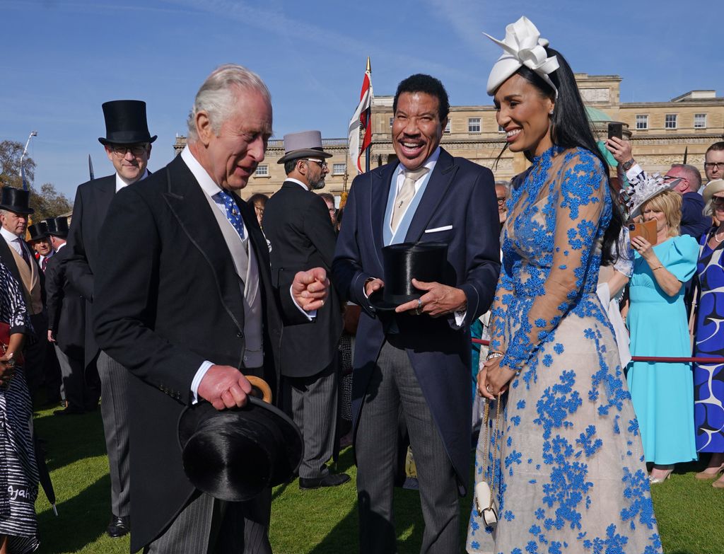 King Charles III speaks to Lionel Richie and Lisa Parigi 