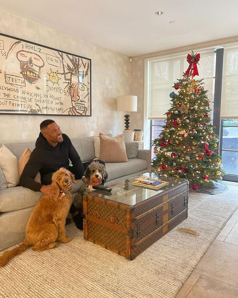Michael Strahan inside his LA home with his dogs Enzo and Zuma