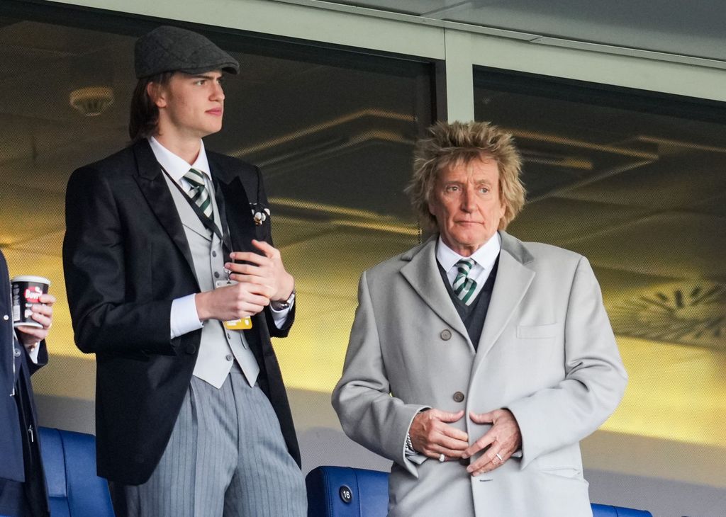 Alastair Stewart and father Rod Stewart looking concerned at a football match