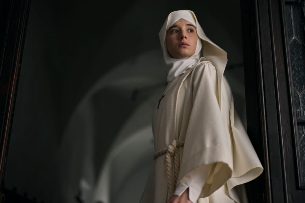 A nun in white clothing in a film