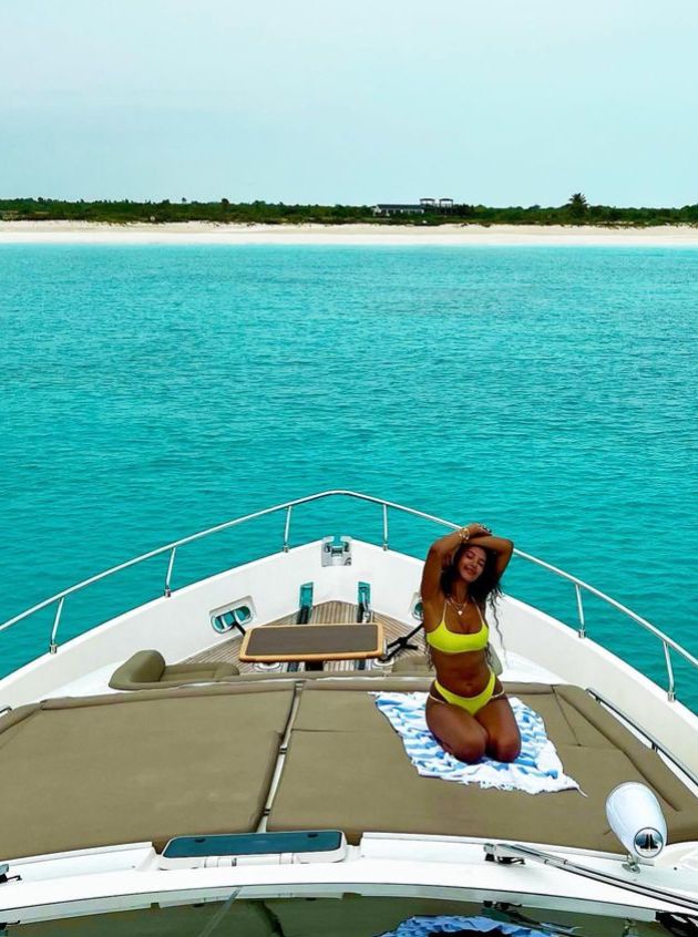 Maya Jama on a yacht in yellow bikini