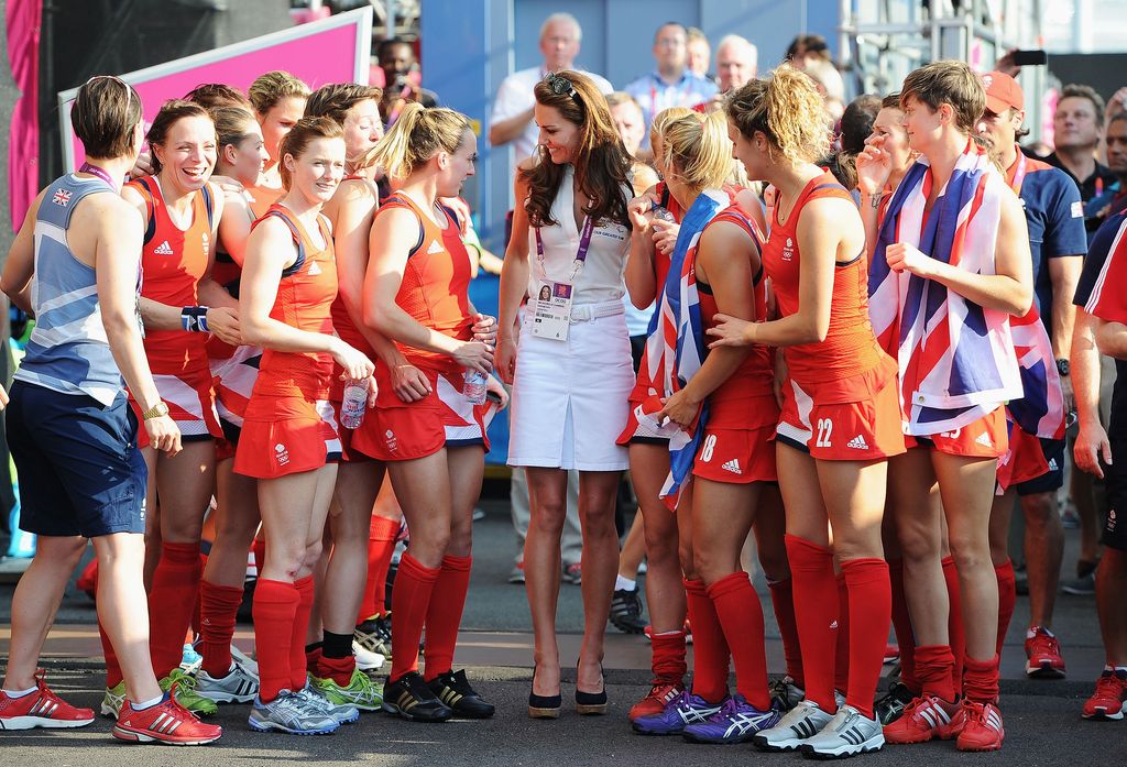 Kate in white among women hockey players