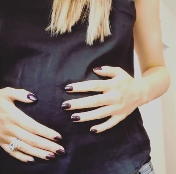 Peter Andre shows off wife's baby bump in video