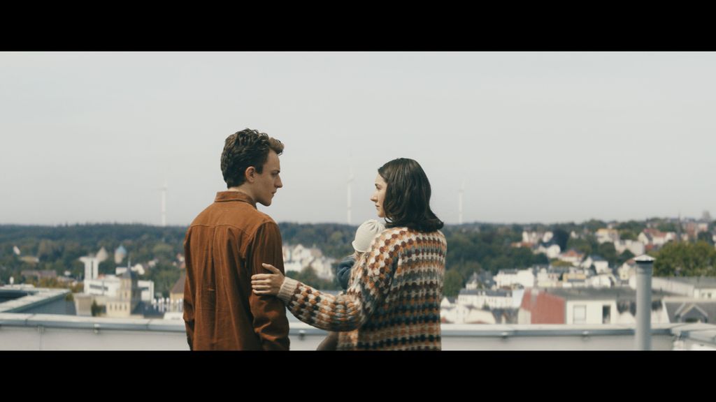 man and woman looking at each other 
