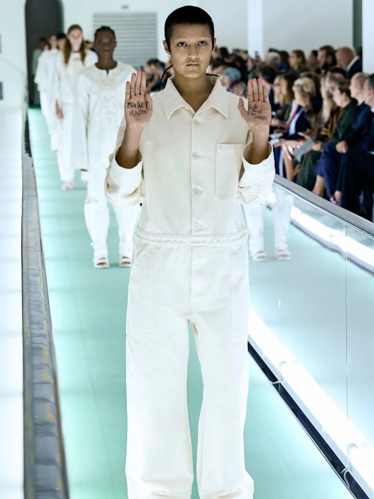 During Gucci's spring/summer 2020 offering, model Ayesha Tan-Jones appeared on the travelator catwalk with 'Mental health is not fashion' written on her hands.
