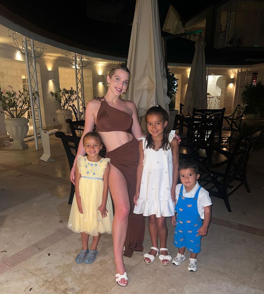 Helen Flanagan on holiday in brown dress with three children in tow