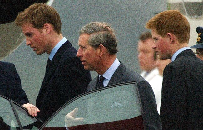 William, Charles and Harry arrive back in the UK in March 2002