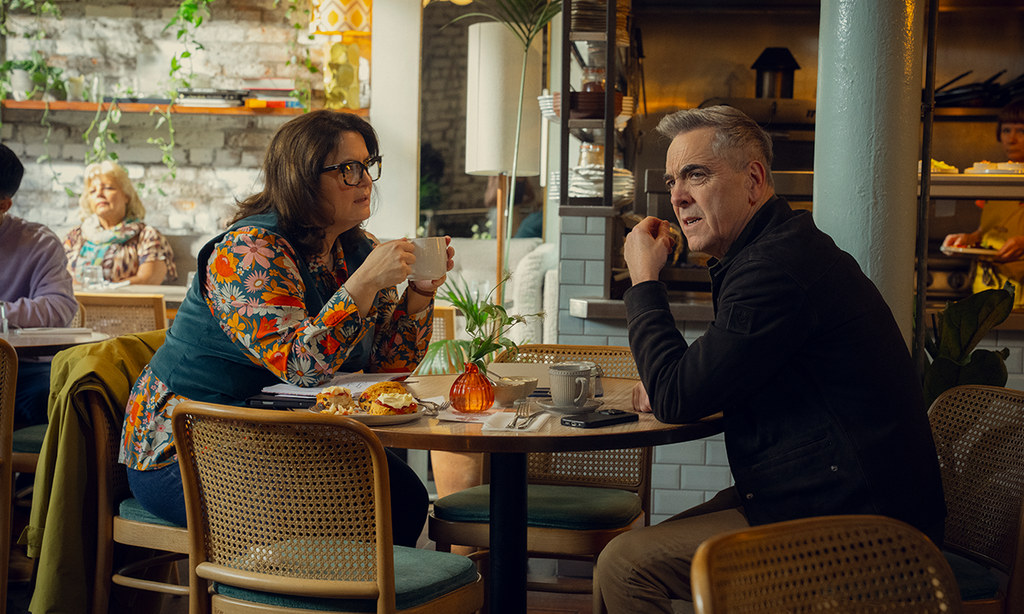 woman and man sitting in cafe